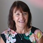 the photo shows our trustee Helena, who is smiling at the camera