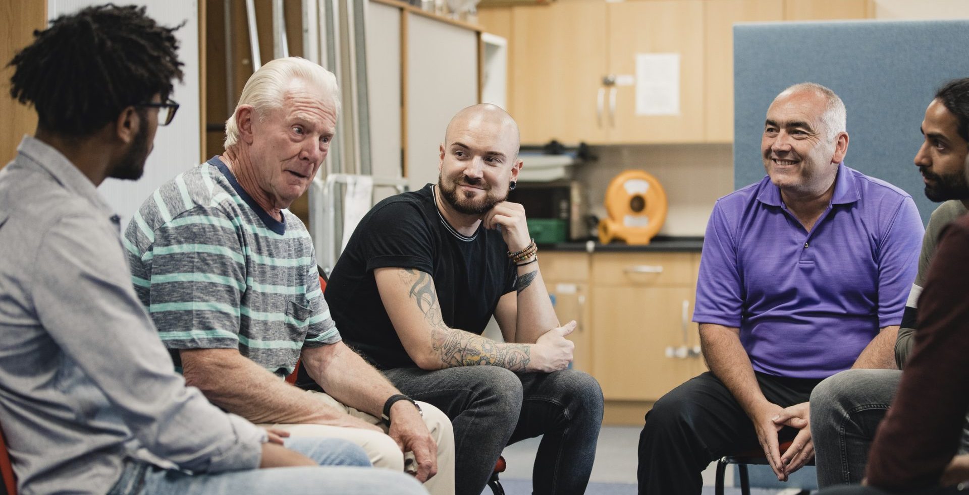 A group of men sat down talking.