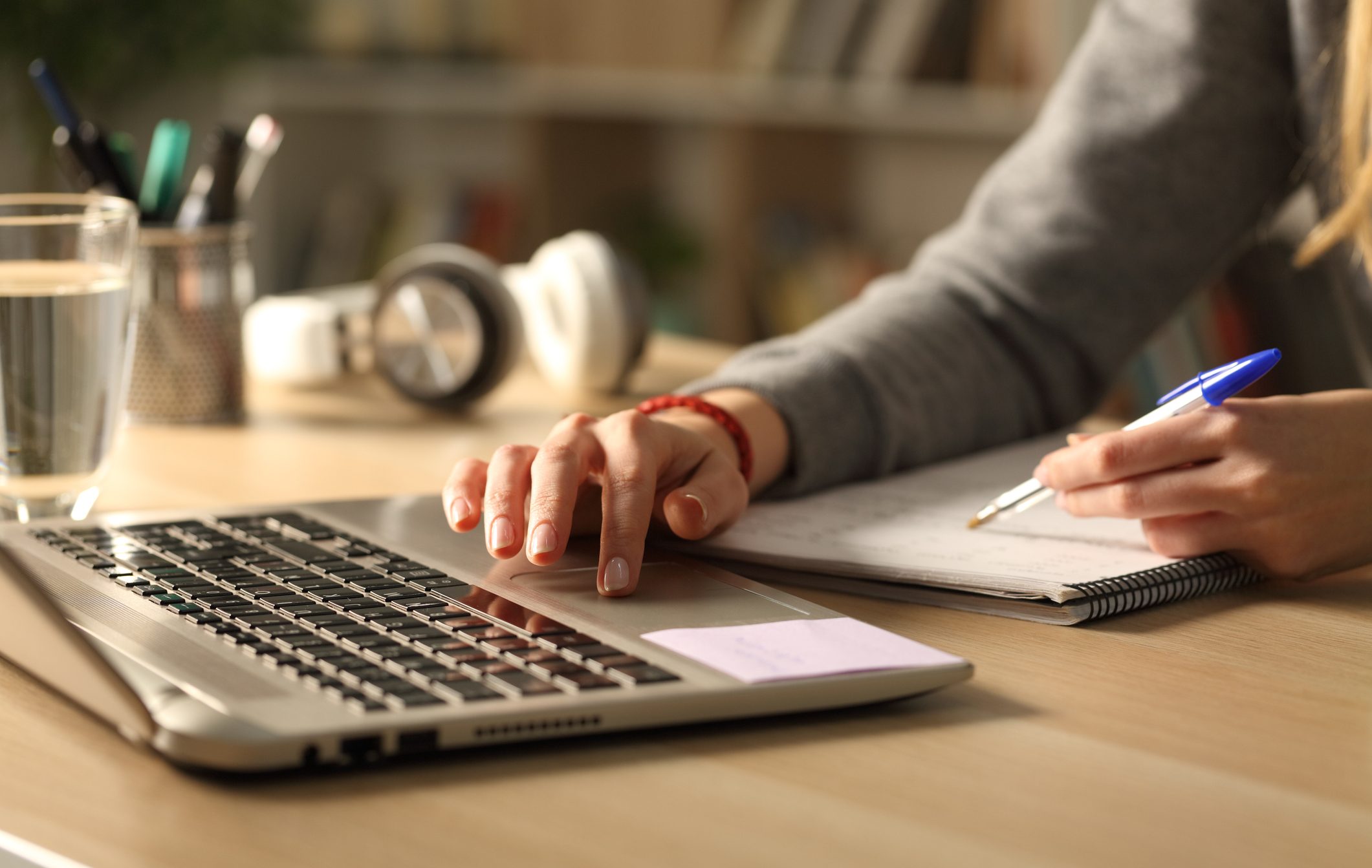the photo shows a desk inside containing a laptop computer